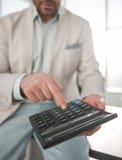 Close up. businessman with calculator. royalty free stock images Close up. businessman with calculator. royalty free stock images