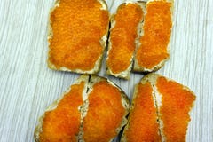Close-up of canapes with butter and salmon caviar. stock photography Close-up of canapes with butter and salmon caviar. stock photography