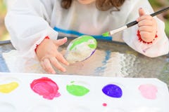 Little Child Drawing On Stone Outdoors On Summer Sunny Day. royalty free stock photo Little Child Drawing On Stone Outdoors On Summer Sunny Day. royalty free stock photo
