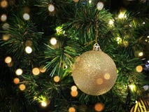 Close up christmas ball hanging on tree with golden bokeh warm concept royalty free stock image Close up christmas ball hanging on tree with golden bokeh warm concept royalty free stock image