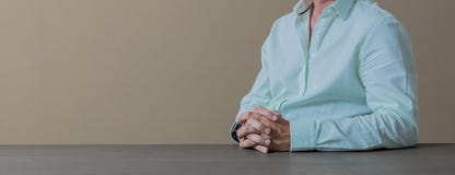 Close up cropped hands and arms of businessman in a light blue c Stock Photos Close up cropped hands and arms of businessman in a light blue c Stock Photos