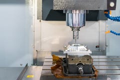 Close up cutting tool working with workpiece by high speed and accuracy cnc machining center royalty free stock photo Close up cutting tool working with workpiece by high speed and accuracy cnc machining center royalty free stock photo