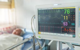 Close up digital device for measuring blood pressure monitor with elderly patient sleep on the bed in hospital Royalty Free Stock Images Close up digital device for measuring blood pressure monitor with elderly patient sleep on the bed in hospital Royalty Free Stock Images