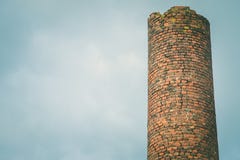 Close-up of factory brick chimney. Air Pollution by Industrial Emissions royalty free stock photo Close-up of factory brick chimney. Air Pollution by Industrial Emissions royalty free stock photo