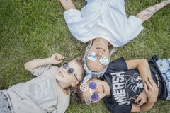Close up of family lying on green grass. View from above. Happy family concept. royalty free stock photos Close up of family lying on green grass. View from above. Happy family concept. royalty free stock photos
