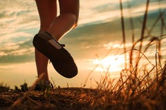 Close up of feet sportwoman in autumn grass royalty free stock photography Close up of feet sportwoman in autumn grass royalty free stock photography