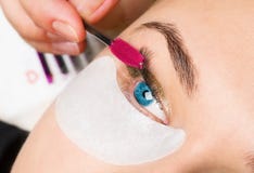 Close-up frame of a girl which paints eyelash royalty free stock photo Close-up frame of a girl which paints eyelash royalty free stock photo