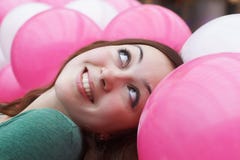 Close-up of a girl smiling in balloons