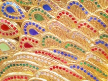 Gold paint with multicolored stained glass patterns texture background in thai temple royalty free stock photo Gold paint with multicolored stained glass patterns texture background in thai temple royalty free stock photo