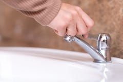 Close up hand open or close water tab . faucet and saving concept royalty free stock photos Close up hand open or close water tab . faucet and saving concept royalty free stock photos