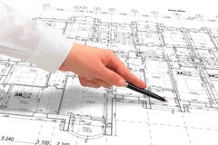 Close up of a hand in white shirt showing some details on the floor plan. Woman architect in white shirt showing some details on the floor plan layout with a pen Royalty Free Stock Image Close up of a hand in white shirt showing some details on the floor plan. Woman architect in white shirt showing some details on the floor plan layout with a pen Royalty Free Stock Image