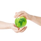 Close up of hands holding green globe Stock Image Close up of hands holding green globe Stock Image