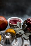 Close up of herbal and organic face pack of pomegranate with lemon juice on wooden surface for Sun tanning. stock image Close up of herbal and organic face pack of pomegranate with lemon juice on wooden surface for Sun tanning. stock image