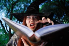 Close-up image of witch reading spell