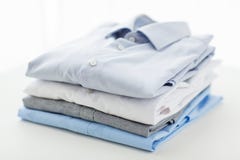 Close up of ironed and folded shirts on table stock photography Close up of ironed and folded shirts on table stock photography
