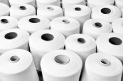 Close up a lot of yarn spools in in a textile factory, Textile i stock photos Close up a lot of yarn spools in in a textile factory, Textile i stock photos