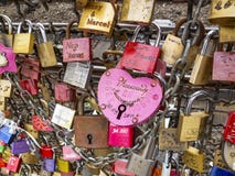 Close-up of love padlocks on the fence between the footpath and the railway lines of Hohenzollern Bridge in Cologne, Germany stock image Close-up of love padlocks on the fence between the footpath and the railway lines of Hohenzollern Bridge in Cologne, Germany stock image