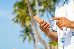 Man on the beach using smartphone. stock image Man on the beach using smartphone. stock image