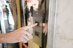 Close up man hand press a up button of elevator inside the building for upper high level floor royalty free stock images Close up man hand press a up button of elevator inside the building for upper high level floor royalty free stock images
