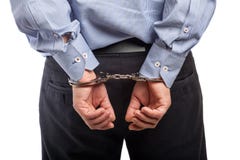 Close up of a man in handcuffs arrested, isolated