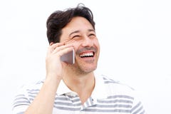 Close up man talking on mobile phone and laughing royalty free stock image Close up man talking on mobile phone and laughing royalty free stock image