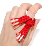 Close-up Of A Crocheted Red And White Scarf On The Hand. Small S Stock Images Close-up Of A Crocheted Red And White Scarf On The Hand. Small S Stock Images