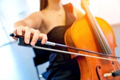 Close Up Of Cello With Bow In Hands Royalty Free Stock Photo