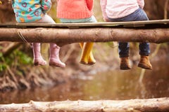 Close Up Of Children S Feet Dangling From Wooden Bridge Royalty Free Stock Photo Close Up Of Children S Feet Dangling From Wooden Bridge Royalty Free Stock Photo