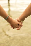 Close Up Of Kids Holding Hands On Beach Concept Royalty Free Stock Photography