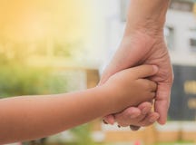 Close Up Of Mother And A Child Hands At The Sunset. Royalty Free Stock Photo