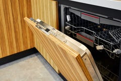 Close up of open dishwasher without clean glasses and dishes stock image Close up of open dishwasher without clean glasses and dishes stock image