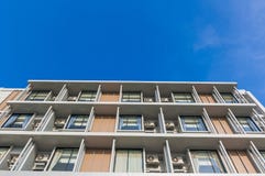 Close up part of condominium modern style on blue sky background royalty free stock photography Close up part of condominium modern style on blue sky background royalty free stock photography