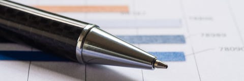 Close-up pen on financial report. Concept of Infomation Data Analysis, Business Investment Analytics and Business Planning. Web stock image Close-up pen on financial report. Concept of Infomation Data Analysis, Business Investment Analytics and Business Planning. Web stock image