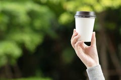 Close up people young female hand holding paper cup of take away drinking coffee royalty free stock photo Close up people young female hand holding paper cup of take away drinking coffee royalty free stock photo