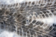 Close-up photo of a road in the winter season. On the dirty snow, a protector is visible from the tires of the truck. royalty free stock photos Close-up photo of a road in the winter season. On the dirty snow, a protector is visible from the tires of the truck. royalty free stock photos