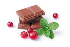 Close-up pieces of milk chocolate bar with fresh cranberry and mint stock photography Close-up pieces of milk chocolate bar with fresh cranberry and mint stock photography
