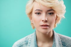 Close up portrait of beautiful blond woman wearing fashion denim jacket stock images Close up portrait of beautiful blond woman wearing fashion denim jacket stock images