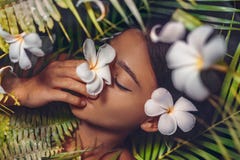 Close up portrait of beautiful woman with frangipani flowers royalty free stock photo Close up portrait of beautiful woman with frangipani flowers royalty free stock photo