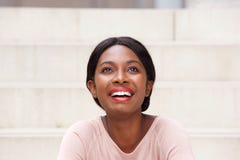 Close up beautiful young black woman laughing and looking up royalty free stock image Close up beautiful young black woman laughing and looking up royalty free stock image