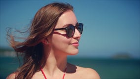 Close up portrait of european beautiful cute brunette young woman or cheerful girl smiling looking at camera, running stock video Close up portrait of european beautiful cute brunette young woman or cheerful girl smiling looking at camera, running stock video