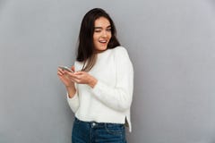 Close-up portrait of funny beautiful woman holding mobile phone royalty free stock photo Close-up portrait of funny beautiful woman holding mobile phone royalty free stock photo