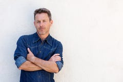 Close up handsome older man standing and thinking with arms crossed Royalty Free Stock Photo Close up handsome older man standing and thinking with arms crossed Royalty Free Stock Photo