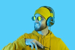 Close Up Portrait Of Funky Young Bearded Hipster Men In Headphone And Sunglasses. DJ In Hoodie Listening Streaming Music Stock Photography