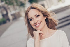 Close up portrait of stunning perfect woman holding her hand nea. R chin on outside background Royalty Free Stock Photography Close up portrait of stunning perfect woman holding her hand nea. R chin on outside background Royalty Free Stock Photography