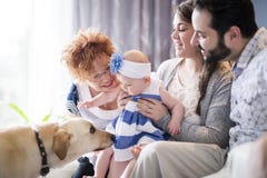 Close up portrait of three generations of women being close, grandmother, mother and baby daughter at home Royalty Free Stock Photography Close up portrait of three generations of women being close, grandmother, mother and baby daughter at home Royalty Free Stock Photography