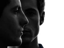 Close up portrait two men twin brother friends silhouette