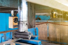 Close up product during press down by manual hydraulic bending machine at factory stock photography Close up product during press down by manual hydraulic bending machine at factory stock photography
