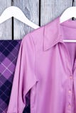 Close up purple silk clothes on hangers. stock photo Close up purple silk clothes on hangers. stock photo