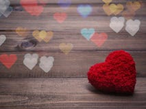 Red cushion heart shape on wood background stock images Red cushion heart shape on wood background stock images
