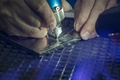 Close Up Scene Of Laser Welding Process By Skill Operator. Stock Photo